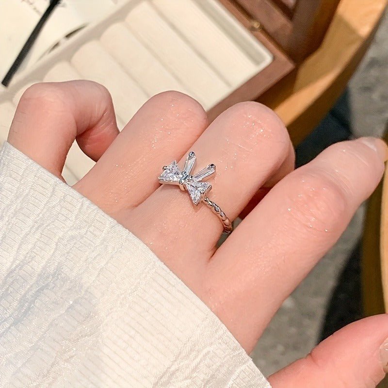 https://cdn.shopify.com/s/files/1/0777/4122/8329/files/elegant-adjustable-womens-bowknot-open-ring-sparkling-rhinestone-details-alloy-perfect-gift-for-her-ideal-for-daily-wear-special-occasions-2166586.jpg?v=1769916550